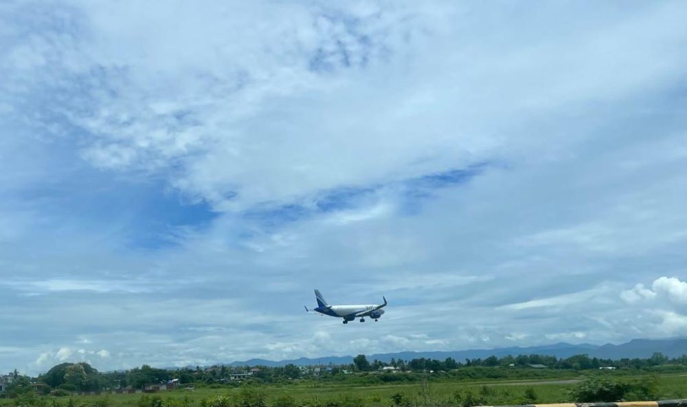 READY IN AIR, STALLED ON GROUND: An aircraft, moments away from touchdown at Dimapur Airport, Nagaland’s only air link. Calls for the release of land required for the long-delayed expansion of the airport have resurfaced in the recent past. (Morung File Photo)
